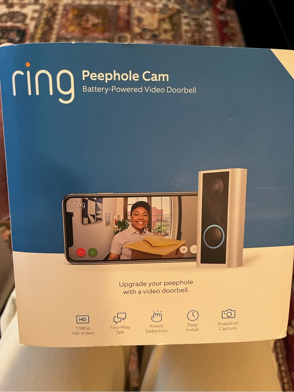 Ring Peephole Cam Battery-Powered Video Doorbell in blue and silver